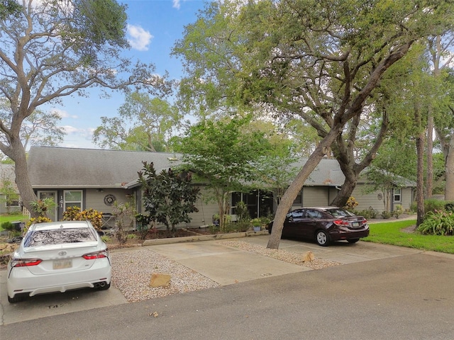 39650 US Highway 19 N Unit 143, Tarpon Springs, FL 34689 - view of front of home featuring a shingled roof