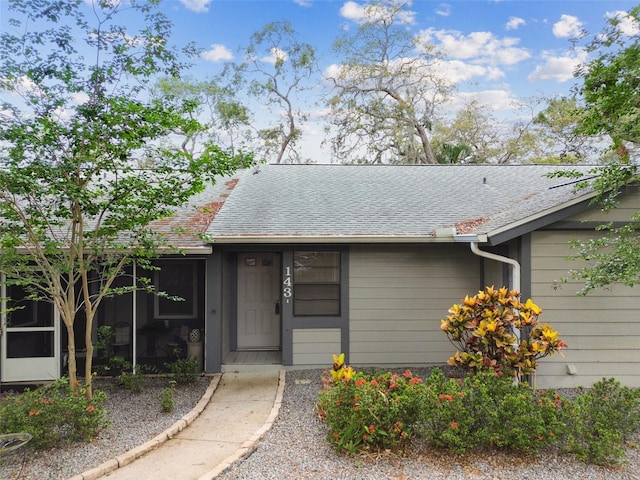 39650 US Highway 19 N Unit 143, Tarpon Springs, FL 34689 - view of exterior entry with a shingled roof