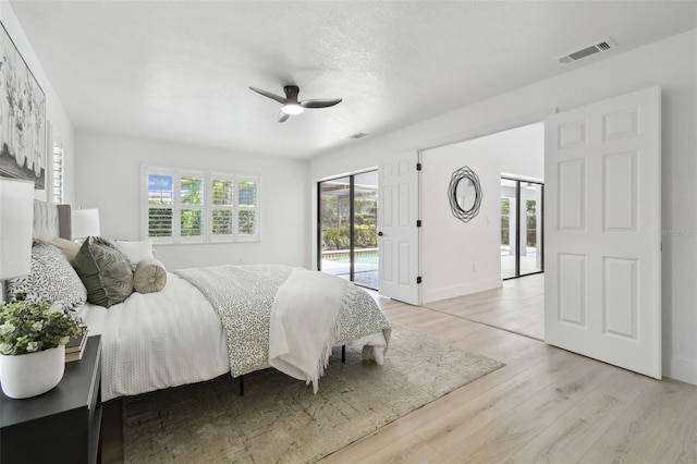 14170 Fennsbury Dr, Tampa, FL 33624 - bedroom with light wood-style floors, access to outside, a ceiling fan, and baseboards