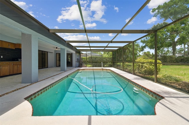 14170 Fennsbury Dr, Tampa, FL 33624 - swimming pool featuring a patio, ceiling fan, and glass enclosure