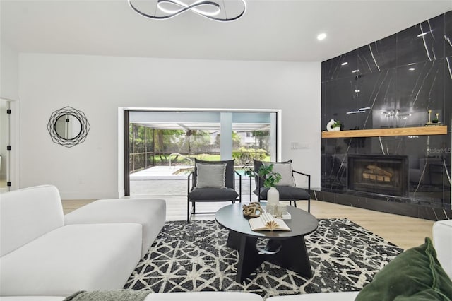 14170 Fennsbury Dr, Tampa, FL 33624 - living room with wood finished floors, a tile fireplace, and recessed lighting