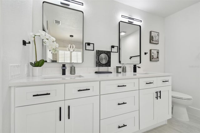 14170 Fennsbury Dr, Tampa, FL 33624 - full bathroom with double vanity and toilet