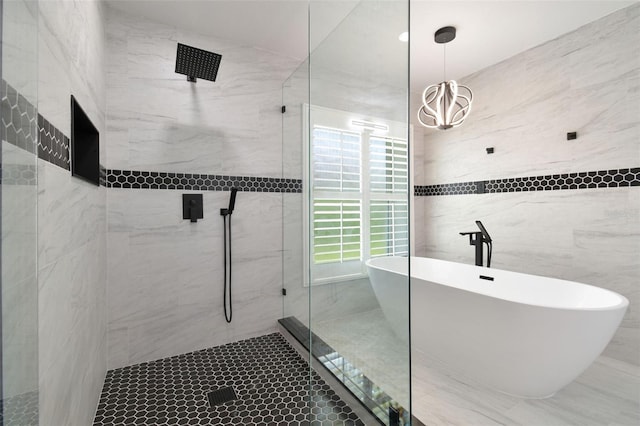 14170 Fennsbury Dr, Tampa, FL 33624 - full bath with a shower stall, a soaking tub, tile walls, and a sink