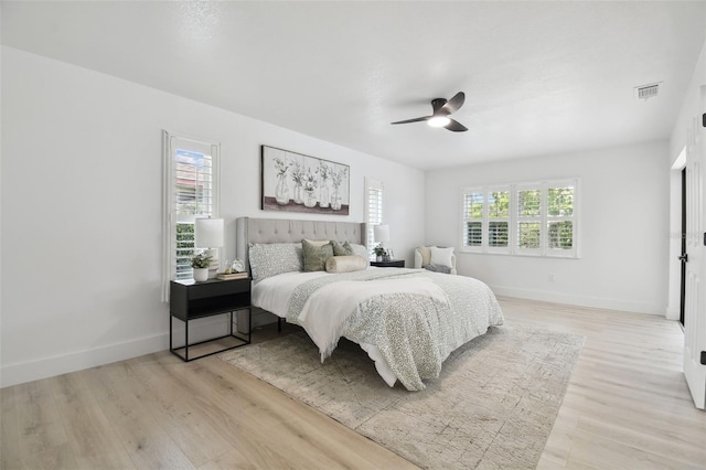 14170 Fennsbury Dr, Tampa, FL 33624 - bedroom with light wood-style flooring, baseboards, and ceiling fan