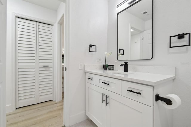 14170 Fennsbury Dr, Tampa, FL 33624 - bathroom with vanity, wood finished floors, and baseboards