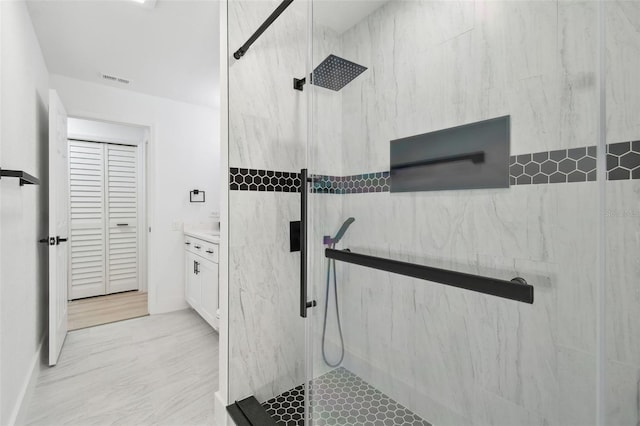 14170 Fennsbury Dr, Tampa, FL 33624 - full bath featuring a marble finish shower, vanity, and a closet