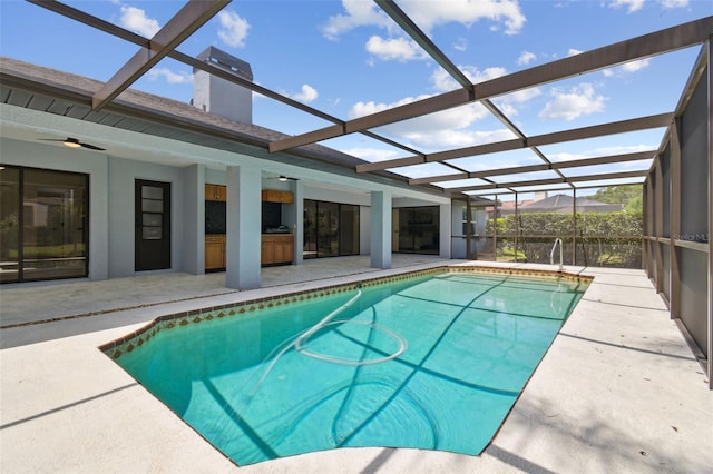 14170 Fennsbury Dr, Tampa, FL 33624 - swimming pool featuring a patio area, a ceiling fan, and glass enclosure