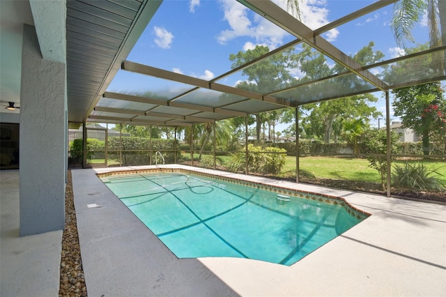 14170 Fennsbury Dr, Tampa, FL 33624 - swimming pool with glass enclosure, a patio, and a lawn