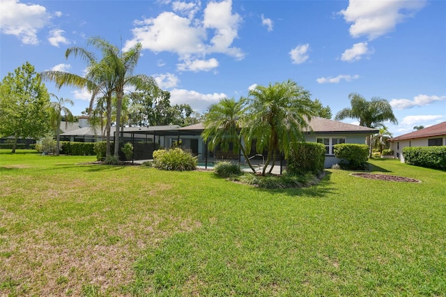14170 Fennsbury Dr, Tampa, FL 33624 - view of green lawn featuring a lanai