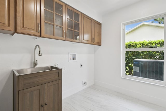 14170 Fennsbury Dr, Tampa, FL 33624 - washroom featuring hookup for an electric dryer, hookup for a washing machine, cabinet space, marble finish floors, and baseboards