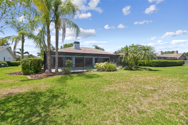 14170 Fennsbury Dr, Tampa, FL 33624 - rear view of property with a lawn