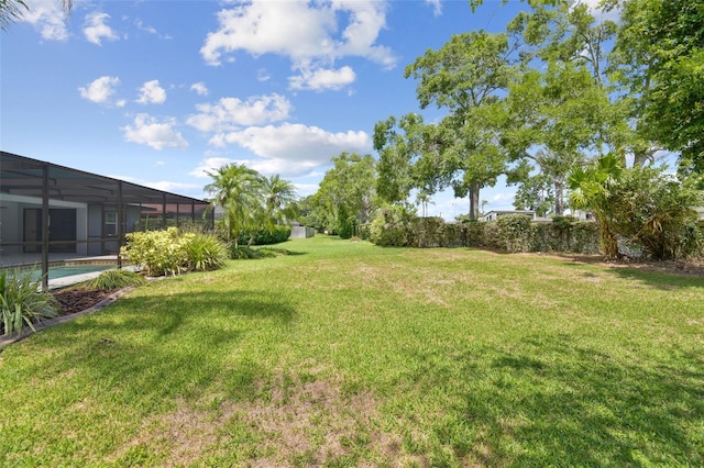 14170 Fennsbury Dr, Tampa, FL 33624 - view of green lawn featuring a lanai