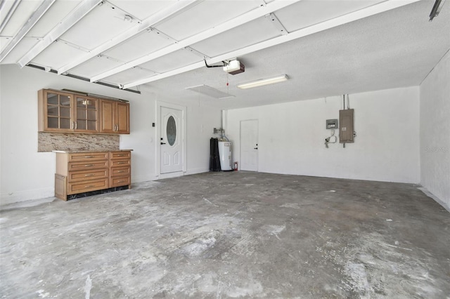 14170 Fennsbury Dr, Tampa, FL 33624 - garage featuring electric water heater, a garage door opener, and electric panel