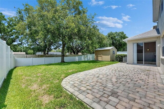 view of yard featuring a patio area and central AC unit
