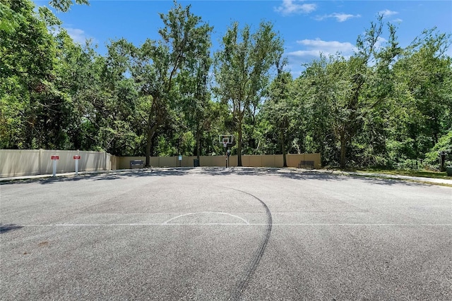 view of basketball court featuring community basketball court and view of scattered trees