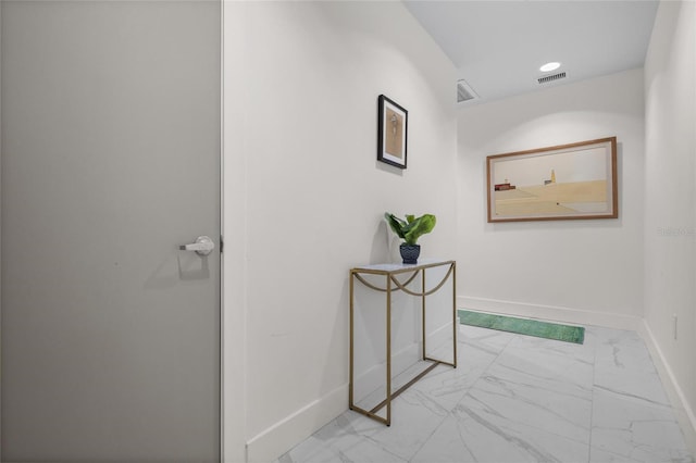 1010 Central Ave Unit 227, Saint Petersburg, FL 33705 - hall featuring marble look tiles and baseboards