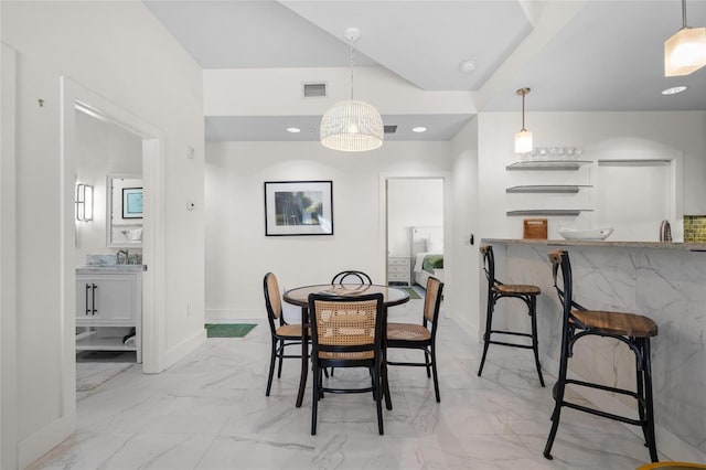 1010 Central Ave Unit 227, Saint Petersburg, FL 33705 - dining space with wet bar, baseboards, light marble finish floors, and recessed lighting