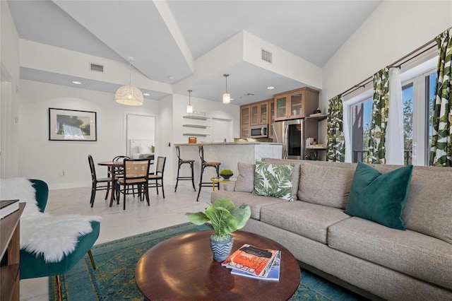 1010 Central Ave Unit 227, Saint Petersburg, FL 33705 - living room with high vaulted ceiling, baseboards, and recessed lighting