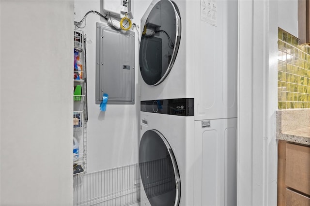 1010 Central Ave Unit 227, Saint Petersburg, FL 33705 - laundry room with stacked washing machine and dryer and electric panel