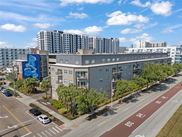 1010 Central Ave Unit 227, Saint Petersburg, FL 33705 - view of apartment building / complex featuring a view of city and uncovered parking