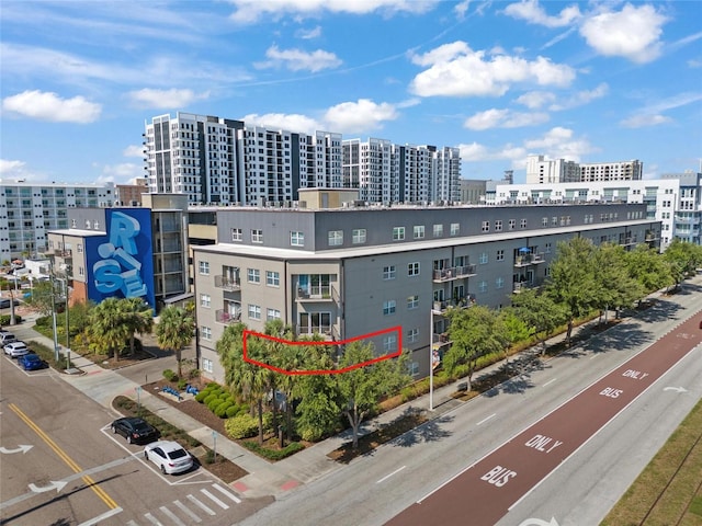 1010 Central Ave Unit 227, Saint Petersburg, FL 33705 - view of apartment building / complex with a city view and uncovered parking