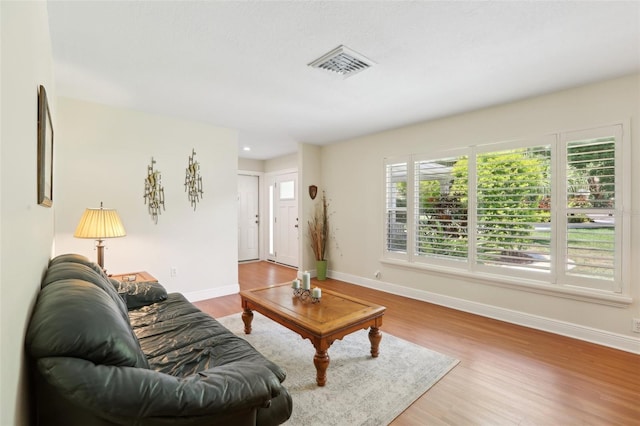 71 Flamingo Cir, Safety Harbor, FL 34695 - living area featuring baseboards and wood finished floors