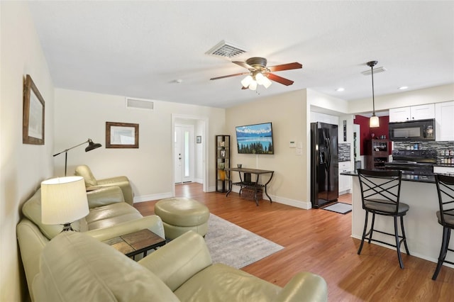 71 Flamingo Cir, Safety Harbor, FL 34695 - living area with ceiling fan, light wood-type flooring, baseboards, and recessed lighting