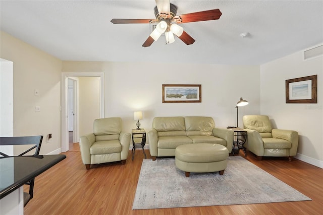 71 Flamingo Cir, Safety Harbor, FL 34695 - living room with a ceiling fan, wood finished floors, and baseboards