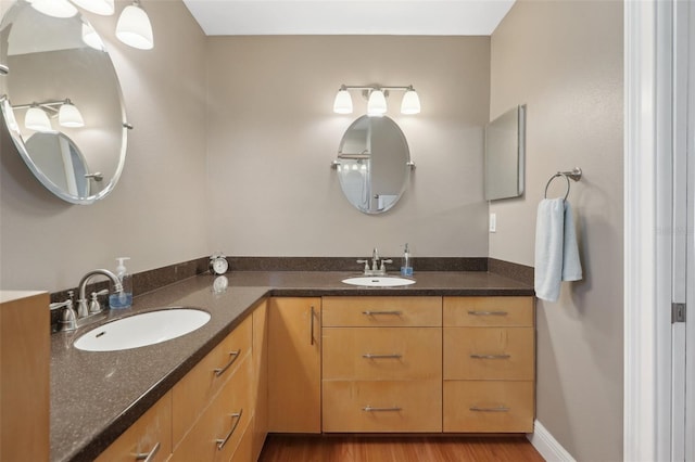 71 Flamingo Cir, Safety Harbor, FL 34695 - full bathroom featuring double vanity and wood finished floors