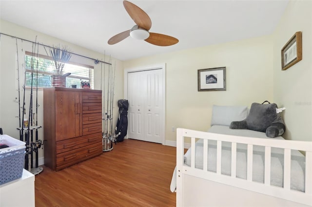 71 Flamingo Cir, Safety Harbor, FL 34695 - bedroom with wood finished floors, a closet, baseboards, and a ceiling fan