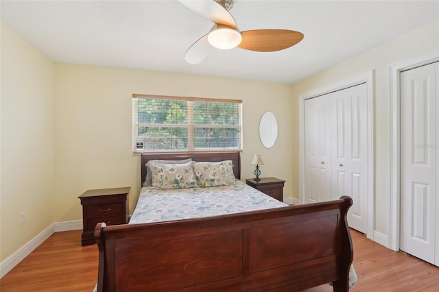 71 Flamingo Cir, Safety Harbor, FL 34695 - bedroom with light wood-type flooring, ceiling fan, baseboards, and multiple closets