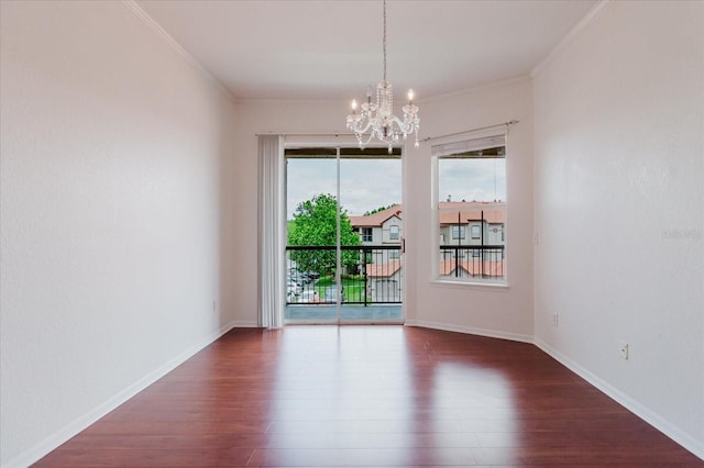 18107 Peregrines Perch Pl Unit 6303, Lutz, FL 33558 - unfurnished room with ornamental molding, wood finished floors, a chandelier, and baseboards