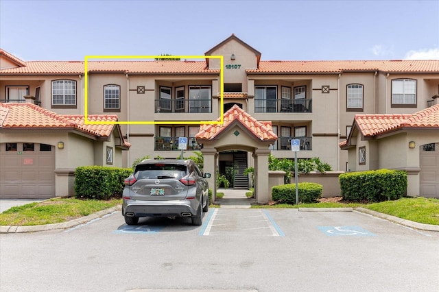 18107 Peregrines Perch Pl Unit 6303, Lutz, FL 33558 - view of property with uncovered parking