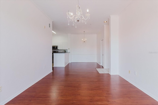 18107 Peregrines Perch Pl Unit 6303, Lutz, FL 33558 - interior space with a chandelier, wood finished floors, and baseboards