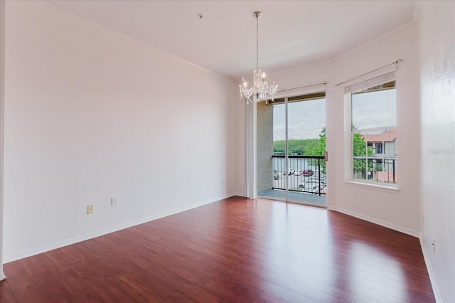 18107 Peregrines Perch Pl Unit 6303, Lutz, FL 33558 - spare room with a chandelier, wood finished floors, and baseboards