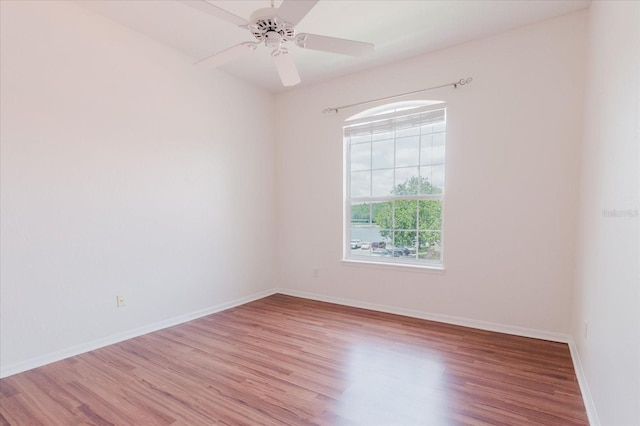 18107 Peregrines Perch Pl Unit 6303, Lutz, FL 33558 - spare room with wood finished floors, baseboards, and ceiling fan