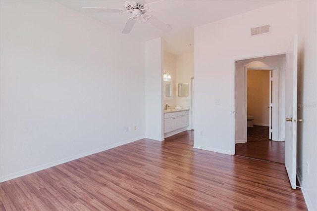 18107 Peregrines Perch Pl Unit 6303, Lutz, FL 33558 - unfurnished room with a sink, light wood-style floors, ceiling fan, and baseboards