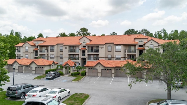 18107 Peregrines Perch Pl Unit 6303, Lutz, FL 33558 - view of property with uncovered parking