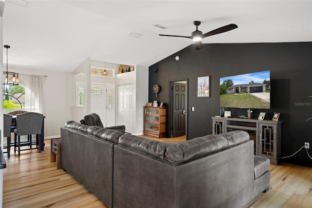 1854 S Overview Dr, Lecanto, FL 34461 - living room featuring vaulted ceiling, light wood finished floors, and a ceiling fan