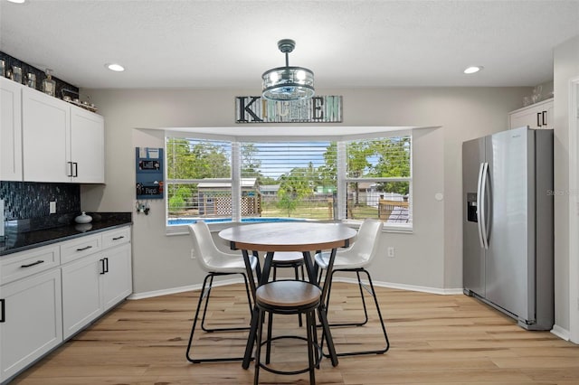 1854 S Overview Dr, Lecanto, FL 34461 - dining area featuring light wood-style floors, recessed lighting, and baseboards
