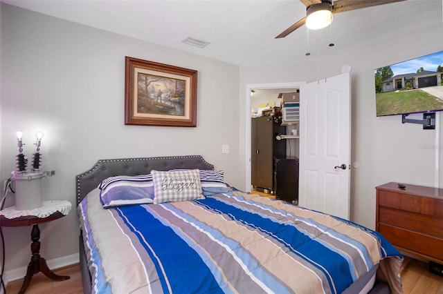 1854 S Overview Dr, Lecanto, FL 34461 - bedroom with wood finished floors, ceiling fan, and baseboards