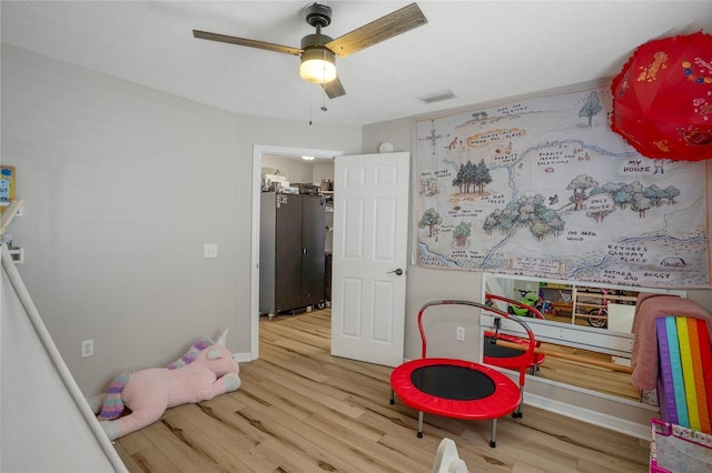 1854 S Overview Dr, Lecanto, FL 34461 - playroom with a ceiling fan, wood finished floors, and baseboards