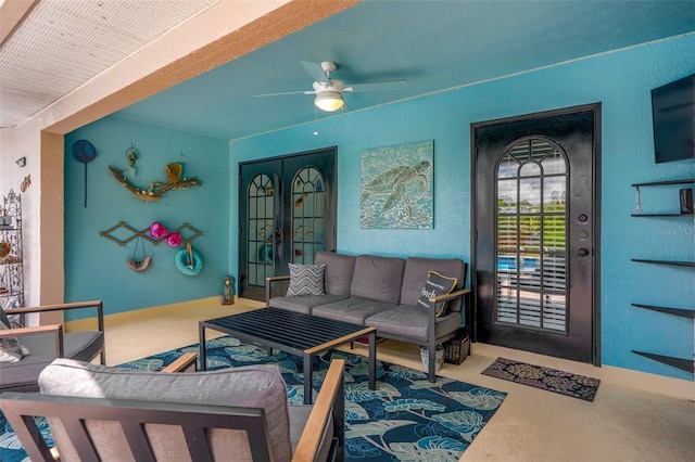 1854 S Overview Dr, Lecanto, FL 34461 - living area featuring ceiling fan, french doors, and concrete flooring