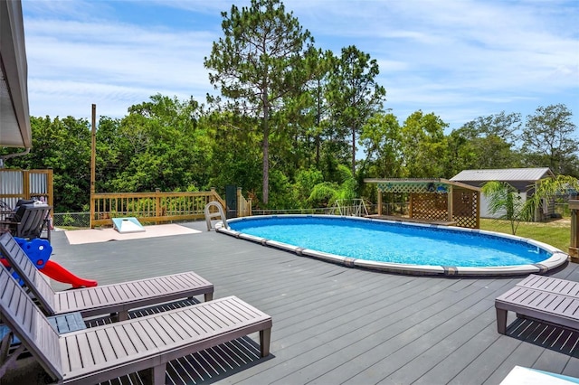 1854 S Overview Dr, Lecanto, FL 34461 - view of swimming pool featuring a wooden deck and view of wooded area