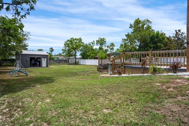 1854 S Overview Dr, Lecanto, FL 34461 - view of yard with a wooden deck and an outbuilding