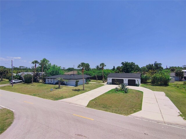 20295 Lorenzo Ave, Port Charlotte, FL 33952 - ranch-style home with a front lawn and driveway