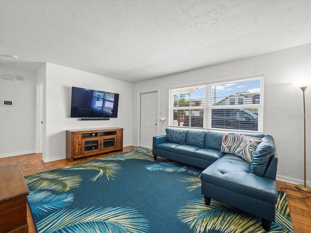 4005 W Coachman Ave, Tampa, FL 33611 - living area with a textured ceiling and baseboards