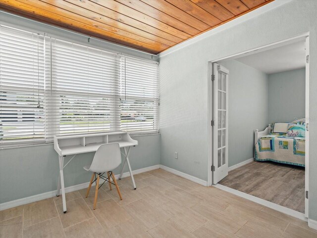 4005 W Coachman Ave, Tampa, FL 33611 - home office with wooden ceiling, baseboards, and wood finished floors