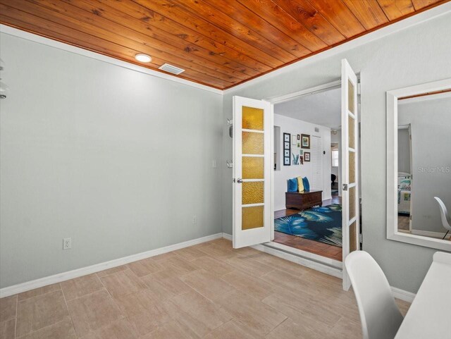 4005 W Coachman Ave, Tampa, FL 33611 - home office featuring wooden ceiling, french doors, and baseboards