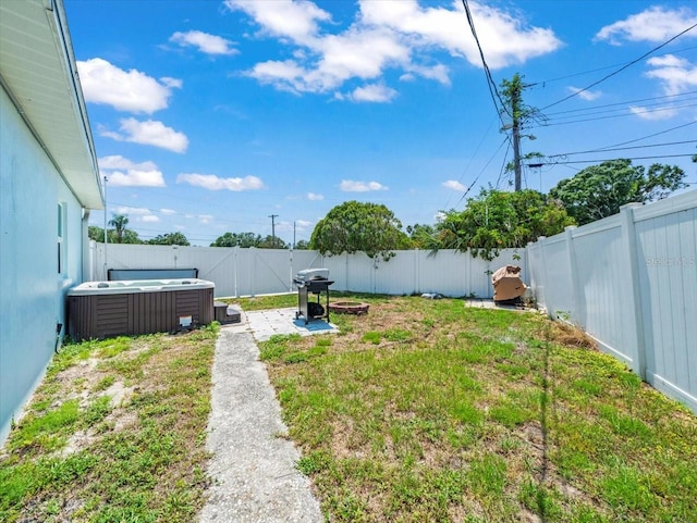 4005 W Coachman Ave, Tampa, FL 33611 - fenced backyard with a hot tub and central AC unit